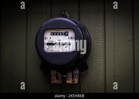 Old retro electric meter. Stock Photo