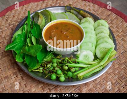 Myanmar or Burmese Traditional Fish Preserve Sauce, Ngapi yay and Fresh boiled Vegetables. Stock Photo
