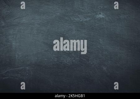 Dark gloomy black and blue slate background or texture Stock Photo