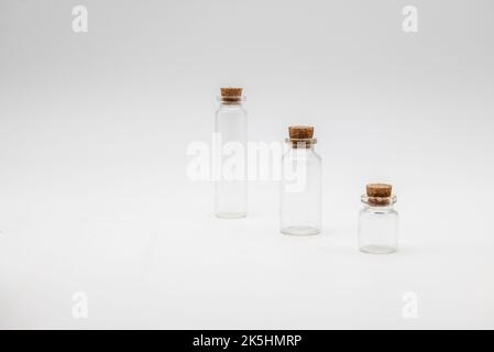 Three empty apothecary bottles isolated on a white background. Stock Photo