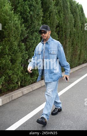 Suzuka, Japan. 8th Oct, 2022. LEWIS HAMILTON wearing a hat, denim jeans and jacket with big black boots as he arrives to the paddock ahead of Practice Session 3 of the Formula 1 Honda Japanese Grand Prix. (Credit Image: © Taidgh Barron/ZUMA Press Wire) Stock Photo