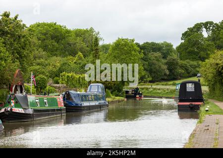 NORTHAMPTONSHIRE, UK - May 25, 2022. Narrowboats on the Grand Union Canal at Stoke Bruerne village Stock Photo
