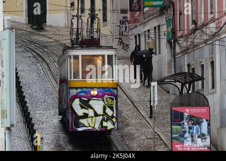 Lisbon, Portugal - September 2022: Historic Ascensor da Gloria (Gloria Funicular), covered in graffiti. It connects Restauradores Square with Rua San Stock Photo