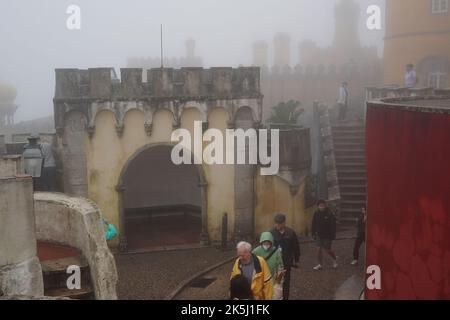 Sintra, Portugal - September 2022: Thick fog covers Sintra Palace (Palacio Nacional da Pena), Portugal Stock Photo