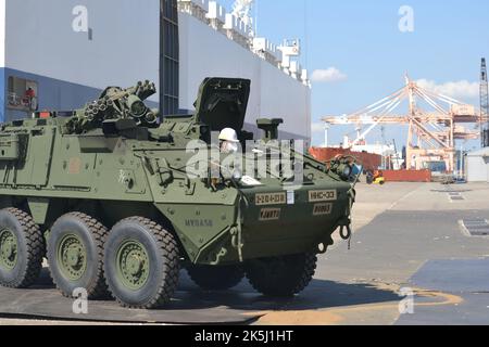 Stryker vehicles from 2nd Stryker Brigade Combat Team, 2nd Infantry Division are offloaded at the Port of Pyeongtaek, South Korea on Oct. 8, 2022. (U.S. Army photo by Lt. Col. Neil Penttila/Eighth Army public affairs office) Stock Photo