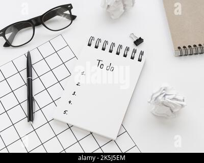 High angle list notepad with glasses pen Stock Photo