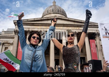 Protestors gathered in Trafalgar Square, demonstrating against the death of Mahsa Amini who died whilst been detained by the Iranian police. Stock Photo