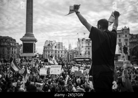 Protestors gathered in Trafalgar Square, demonstrating against the death of Mahsa Amini who died whilst been detained by the Iranian police. Stock Photo