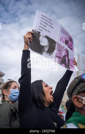 Protestors gathered in Trafalgar Square, demonstrating against the death of Mahsa Amini who died whilst been detained by the Iranian police. Stock Photo