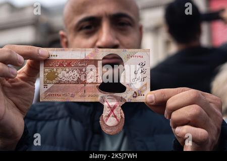 Protestors gathered in Trafalgar Square, demonstrating against the death of Mahsa Amini who died whilst been detained by the Iranian police. Stock Photo