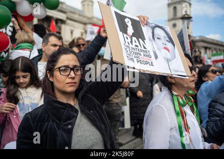 Protestors gathered in Trafalgar Square, demonstrating against the death of Mahsa Amini who died whilst been detained by the Iranian police. Stock Photo