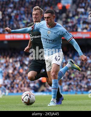 Manchester, England, 8th October 2022.  James Ward-Prowse of Southampton (L) challenges Phil Foden of Manchester City during the Premier League match at the Etihad Stadium, Manchester. Picture credit should read: Darren Staples / Sportimage Stock Photo