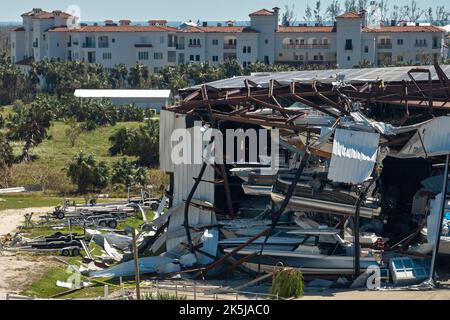 Hurricane Ian destroyed boat station in Florida coastal area. Natural disaster and its consequences. Stock Photo