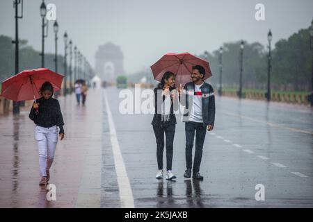 New Delhi, India. 08th Oct, 2022. Young people seen enjoying rain near the India Gate on Kartavya Path (formerly Rajpath) New Delhi, India. (Photo by Pradeep Gaur/SOPA Images/Sipa USA) Credit: Sipa USA/Alamy Live News Stock Photo