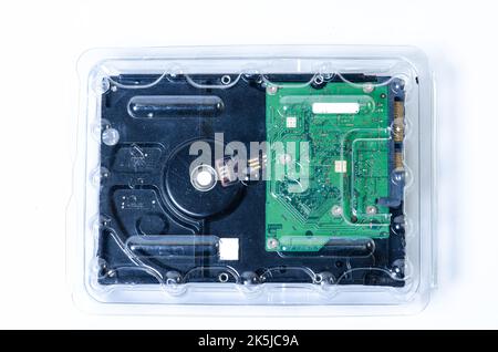 Hard disk drive HDD of different size isolated on white. Detailed view of the inside of a hard disk drive HDD Hard Drives data storage side by side wi Stock Photo