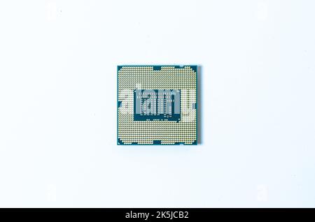 Computer processor CPU  Central processing unit microchip  isolated on white background Closeup  the bottom side, socket contact for personal computer Stock Photo