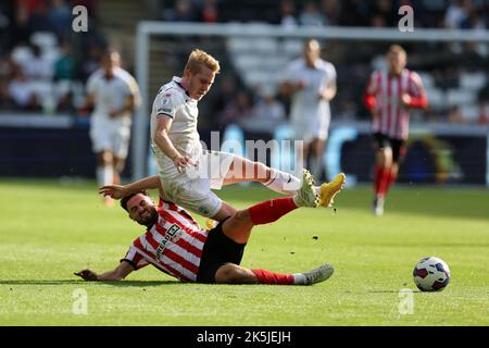 Swansea, UK. 08th Oct, 2022. Harry Darling of Swansea City is fouled. EFL Skybet championship match, Swansea city v Sunderland at the Swansea.com Stadium in Swansea, Wales on Saturday 8th October 2022. this image may only be used for Editorial purposes. Editorial use only, license required for commercial use. No use in betting, games or a single club/league/player publications. pic by Andrew Orchard/Andrew Orchard sports photography/Alamy Live news Credit: Andrew Orchard sports photography/Alamy Live News Stock Photo
