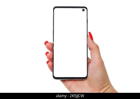 Female hands hold a smartphone with a white display on a white isolated background Stock Photo
