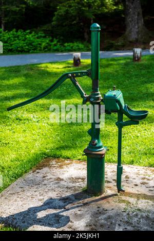 An old fashioned hand powered water pump in a garden in black and white  Stock Photo - Alamy