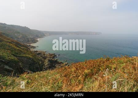 View at the atlantic coastline along to cap frehel on a hazy summer day, Brittany, France Stock Photo