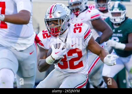 Ohio State running back TreVeyon Henderson (32) rushes during the first ...