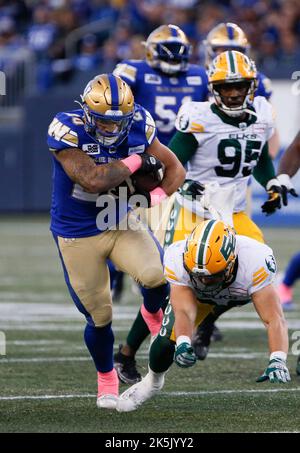 Winnipeg Blue Bombers' Greg McCrae (29) and Brady Oliveira (20) celebrate  Oliveira‚Äôs touchdown against the Edmonton Elks during first half CFL  action in Winnipeg on October 8, 2022. Oliveira will make his