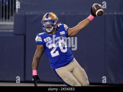 Winnipeg Blue Bombers' Greg McCrae (29) and Brady Oliveira (20) celebrate  Oliveira‚Äôs touchdown against the Edmonton Elks during first half CFL  action in Winnipeg on October 8, 2022. Oliveira will make his