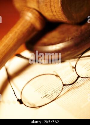 What is the law really. A close up shot of a judges table with a dictionary open to the word Law. Stock Photo