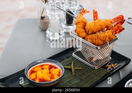 Thai baked shrimp breaded with spicy mango sauce Stock Photo