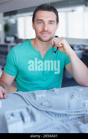 This building is gonna be awesome. a businessman working on his building project. Stock Photo