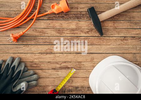 Flat lay composition with different construction tools on wooden background. Stock Photo