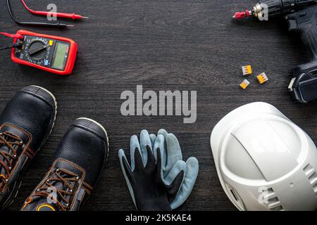 Different electrical tools on wooden background, flat lay. Stock Photo