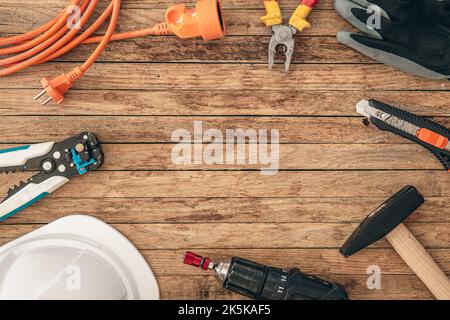 Flat lay composition with different construction tools on wooden background. Stock Photo