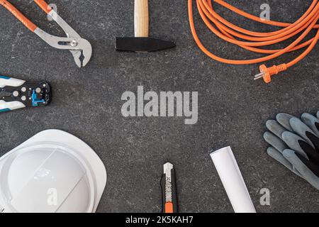Set of repair tools on textured dark background, flat lay. Stock Photo