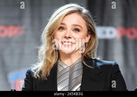 Chloe Grace Moretz flashes a wide smile while promoting her upcoming series  The Peripheral at NYCC