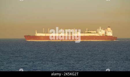 Merchant ship carrying LNG is underway at sea in calm weather Stock Photo