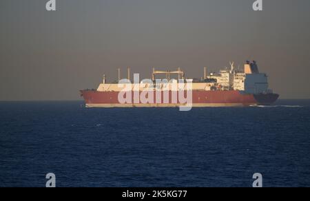 Merchant ship carrying LNG is underway at sea in calm weather Stock Photo