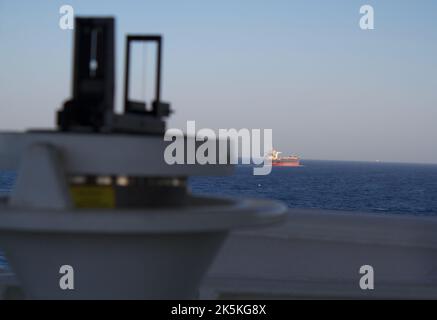 View of ship magnetic compass with navigation instruments seen trough ...