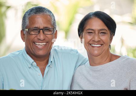 Smile, happy or bonding mature couple in house or home garden in trust, security and love marriage. Portrait of retirement, elderly or senior man and Stock Photo