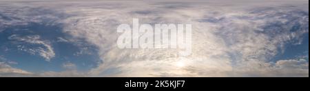 Dark blue sunset sky panorama with golden Cumulus clouds. Seamless hdr 360 panorama in spherical equirectangular format. Full zenith for 3D Stock Photo