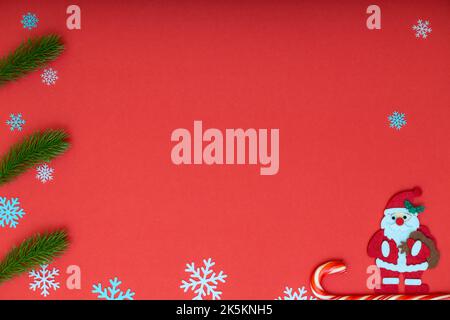 santa claus on a sleigh on a red background. christmas background with santa claus Stock Photo