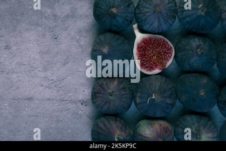 Fig cut in half with figs in row. Stock Photo