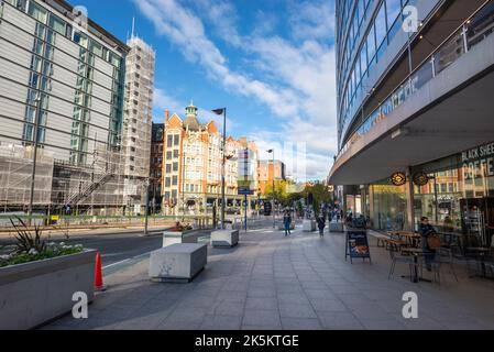Shops by Piccadilly Station in the centre of Manchester, Northern England. Stock Photo