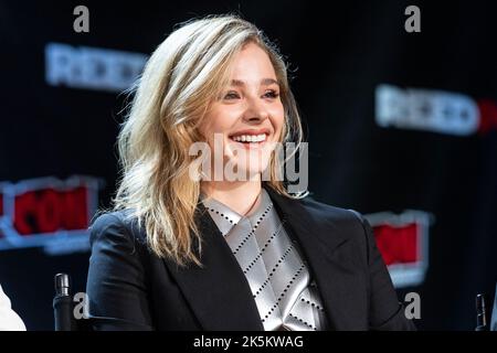 Chloe Grace Moretz flashes a wide smile while promoting her upcoming series  The Peripheral at NYCC