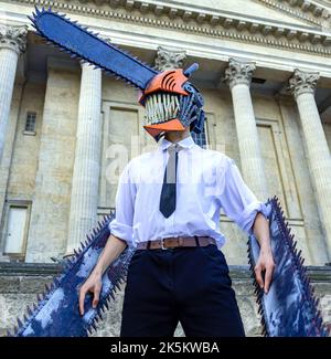 A Person Wearing A Fantastic Denji Chainsaw Man Costume In An Urban ...