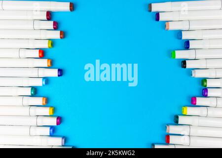 Frame of white markers on a blue background Stock Photo
