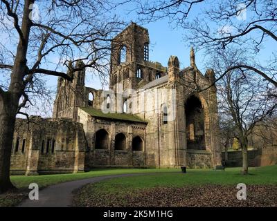 The ruins of Kirkstall Abbey under blue sky in Leeds, England Stock Photo