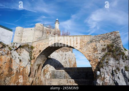The lighthouse and mediaeval bridge in Castro Urdiales, Cantabria, Spain, Europe Stock Photo