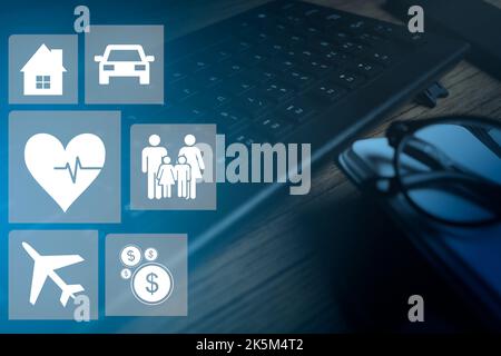 Vintage desktop as background with VR icons illustrating the coverage of policy insurance. Family, life, travel, health, bank, house and car. Wellness Stock Photo