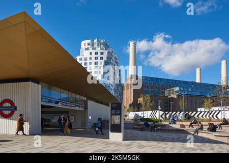 Battersea Power Station tube station entrance, with the redeveloped power station and new apartments, London UK Stock Photo